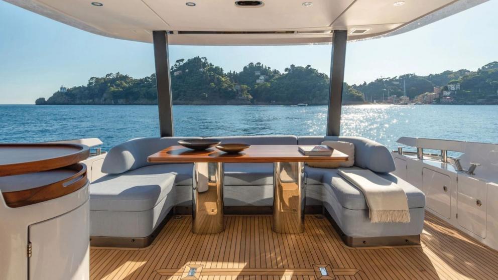 Aft deck dining table on the luxury motor yacht Donna