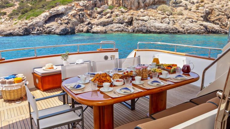 Dining table on the aft deck of luxury motor yacht Efmaria picture 1